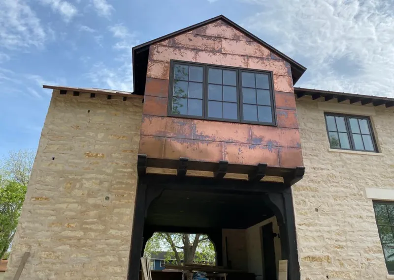 Copper metal panel facade on a stone building for Metal Roof Coating in Lynbrook