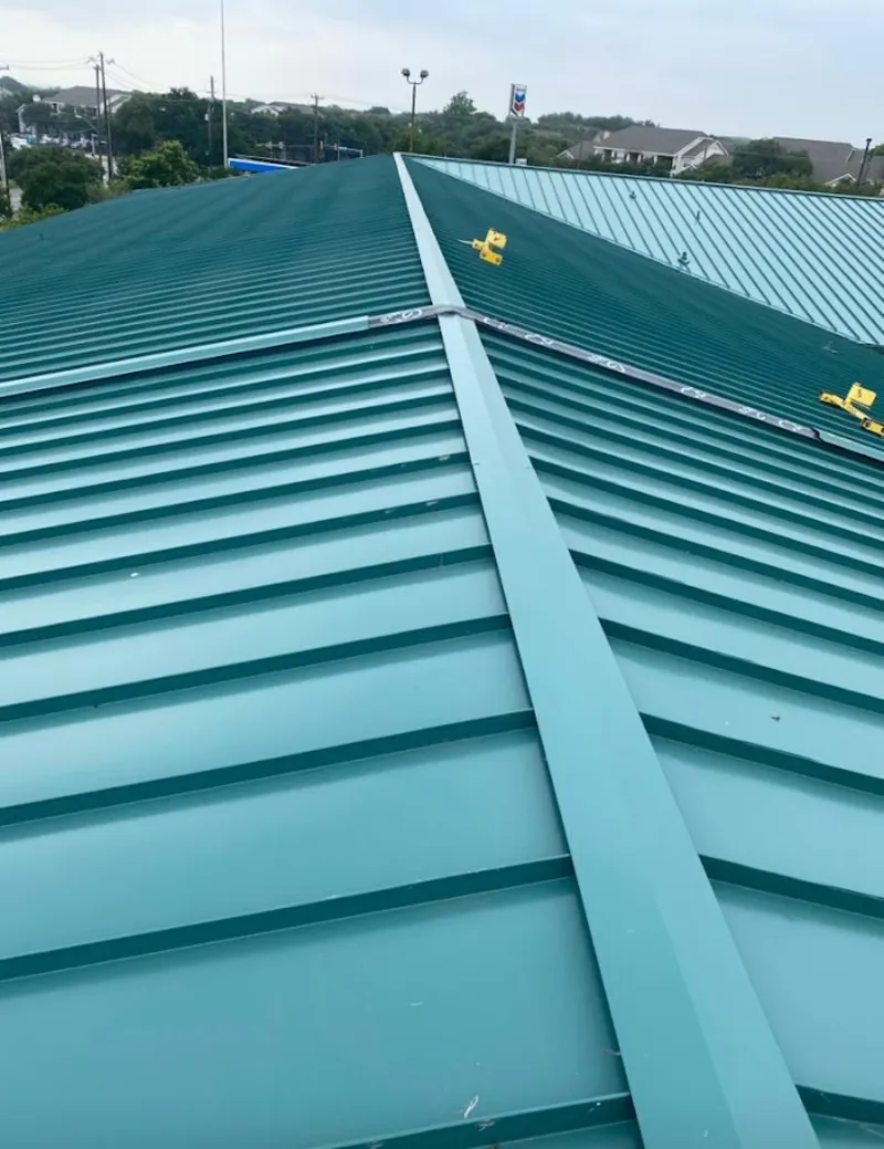 Green commercial metal roof ridge and valley for Metal Roof Repair in Lynbrook